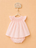 Pink dress with matching ruffled bloomers.